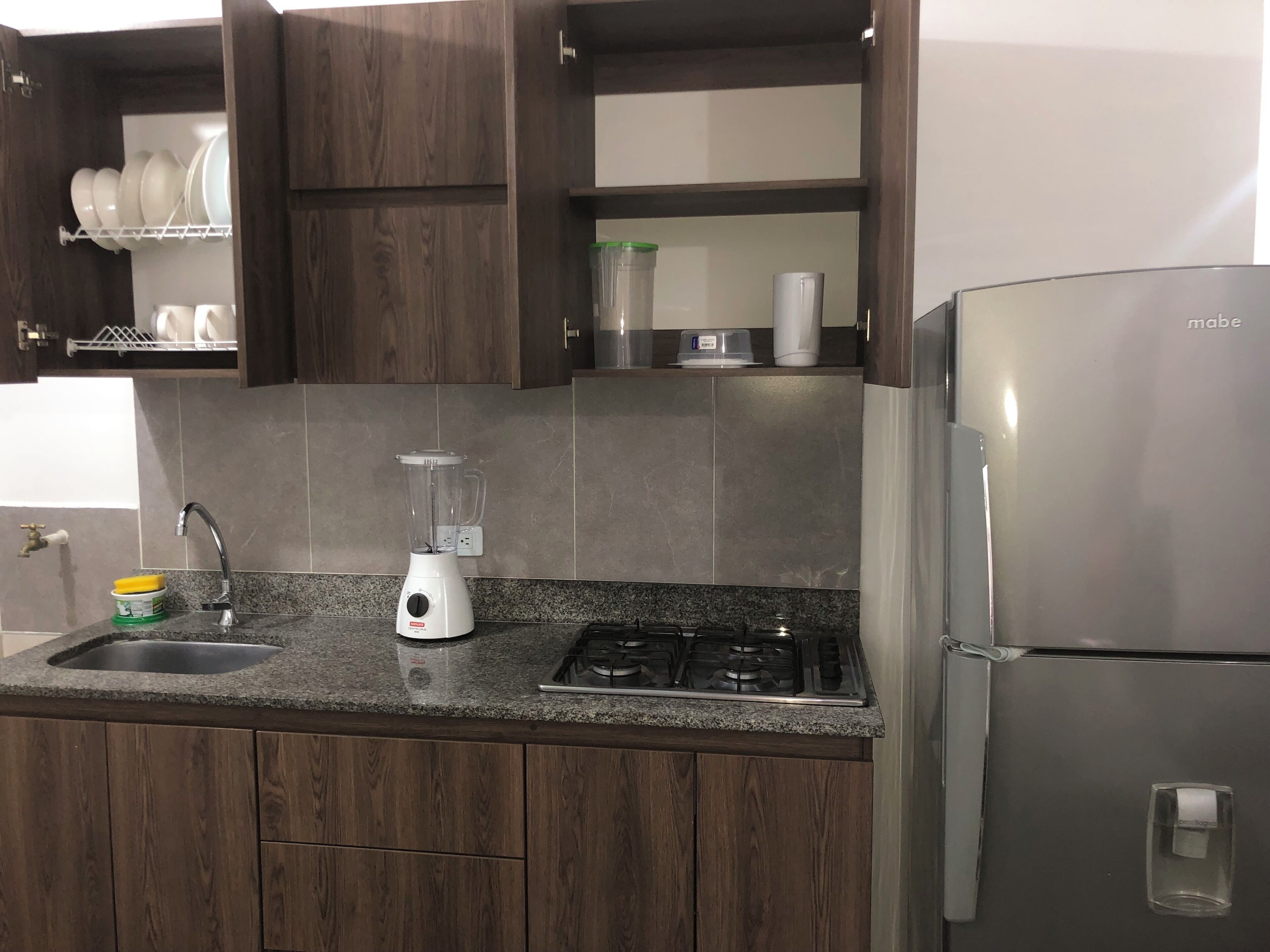 Fridge, microwave, stovetop, coffee/tea maker