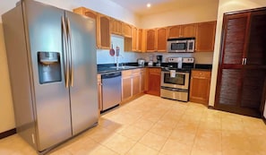 Fridge, coffee/tea maker, cookware/dishes/utensils