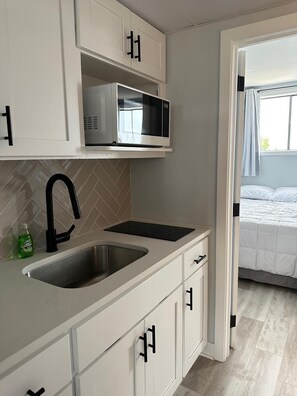 Fridge, microwave, coffee/tea maker, toaster