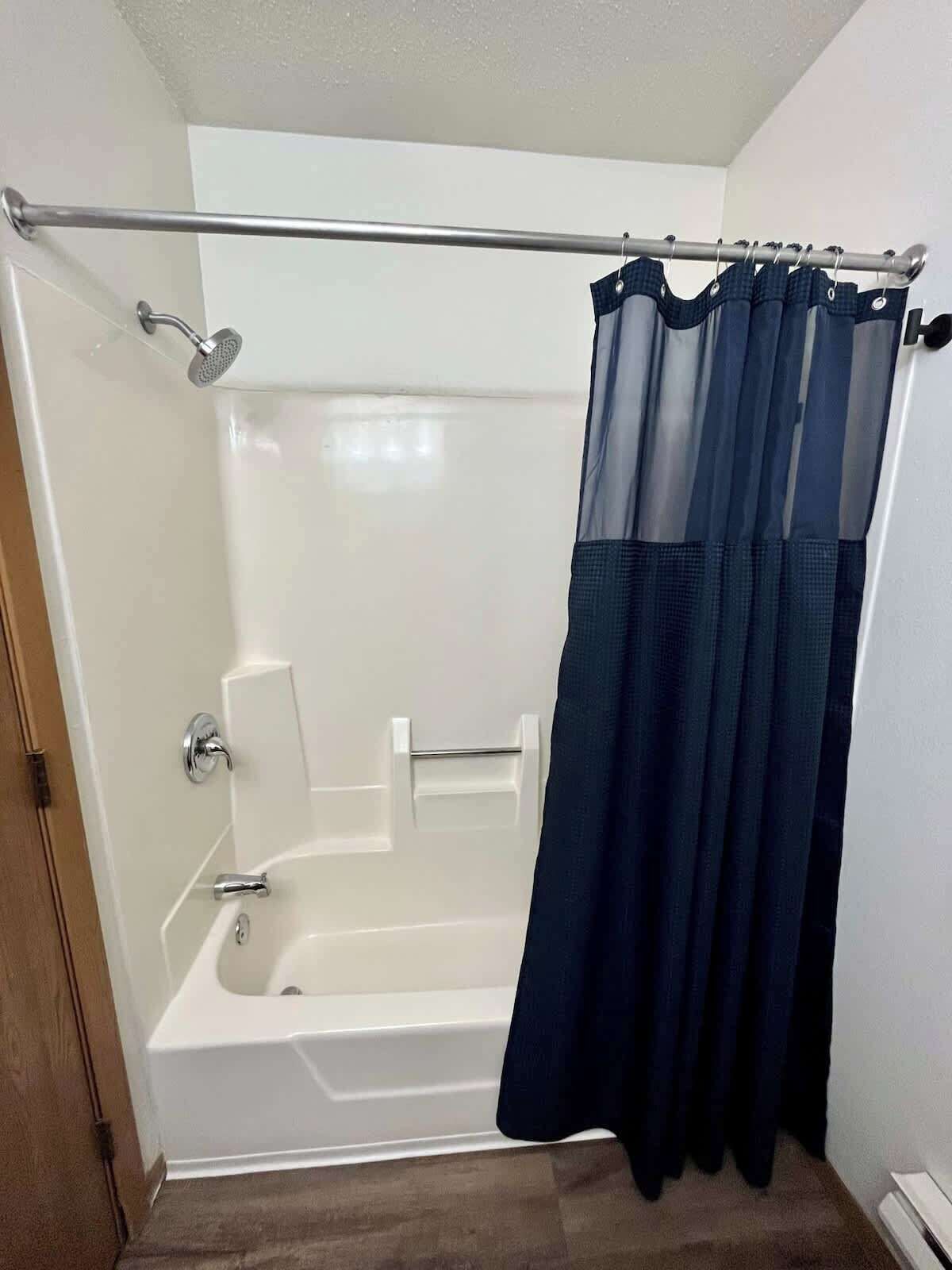 Bathtub, hair dryer, towels
