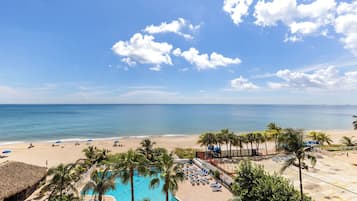On the beach, sun loungers, beach towels