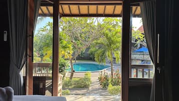Deluxe Room, Pool View | 1 bedroom, Egyptian cotton sheets, premium bedding, pillow-top beds