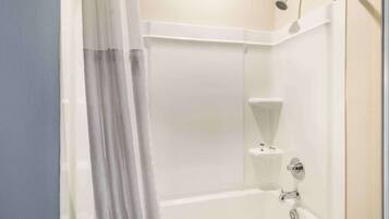 A bathroom with a bathtub, a shower, and a toilet.