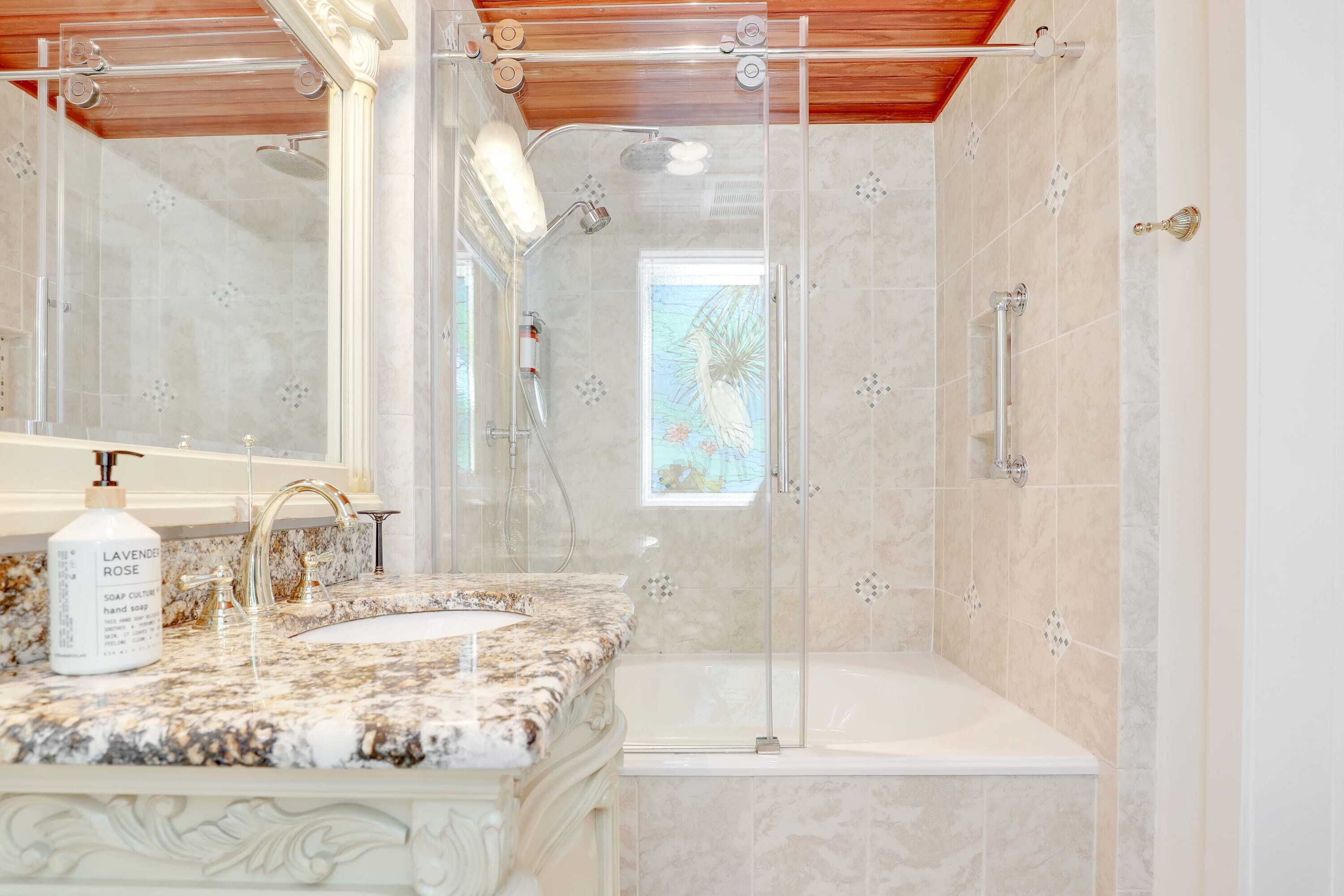 Bathtub, hair dryer, towels, shampoo