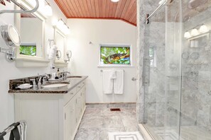 Shower, hair dryer, towels, shampoo