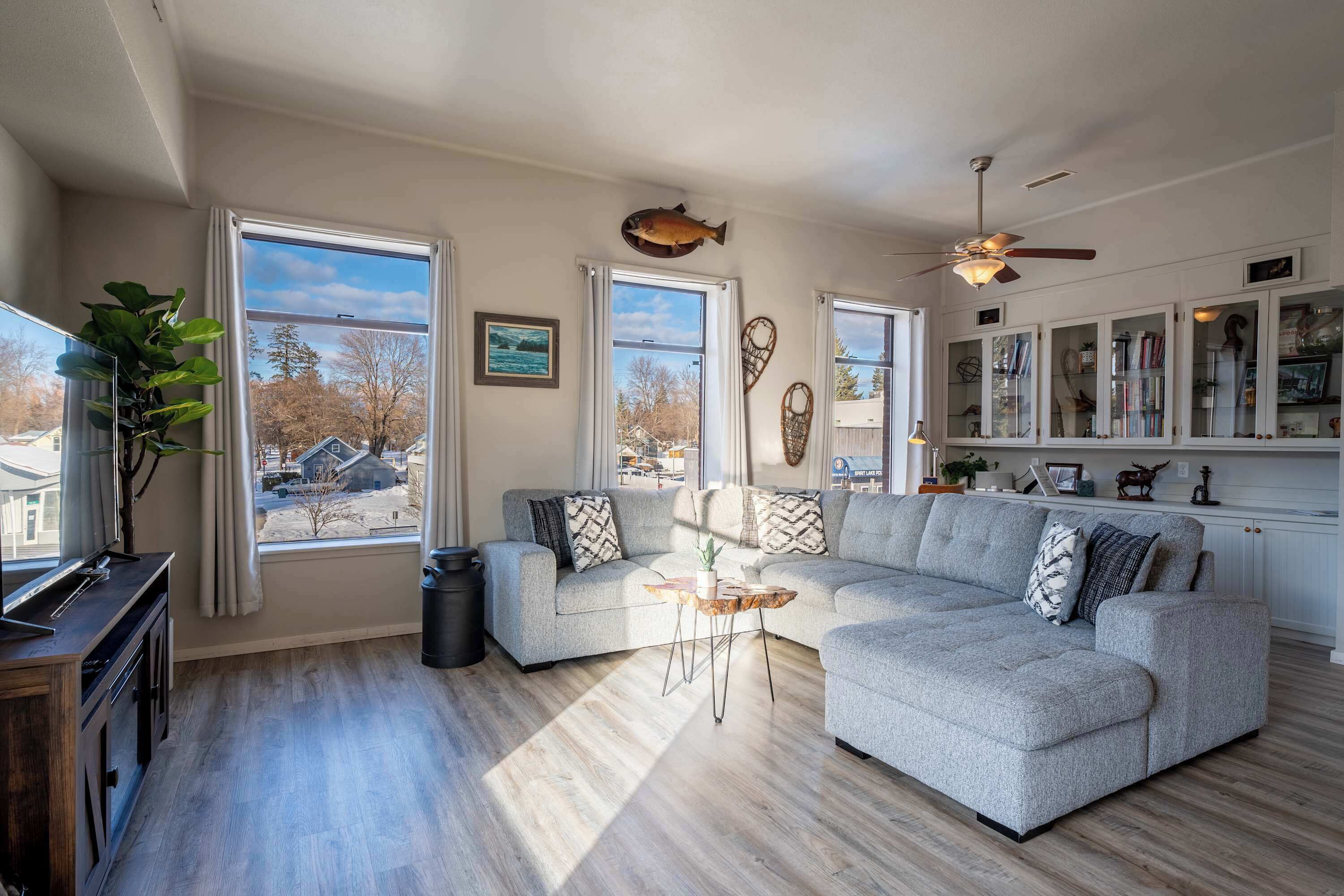 Cozy, historic living space with tall ceilings & warm décor.