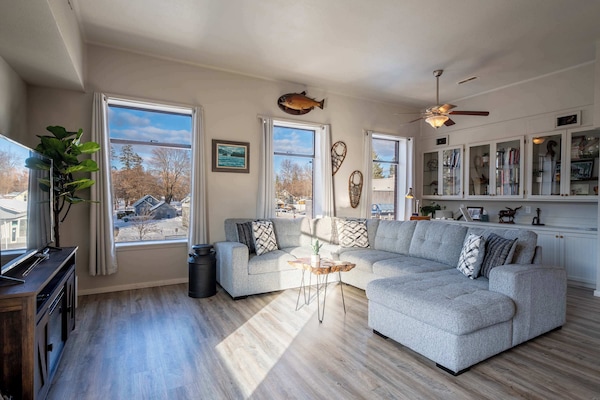 Cozy, historic living space with tall ceilings & warm décor.