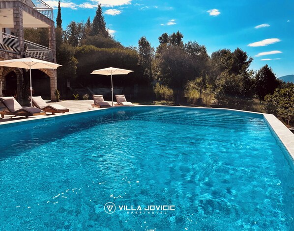 Seasonal outdoor pool, open 6:00 AM to 12:30 AM, pool umbrellas