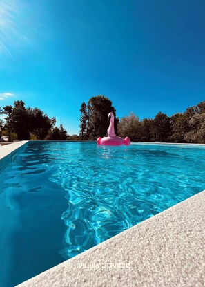 Seasonal outdoor pool, open 6:00 AM to 12:30 AM, pool umbrellas