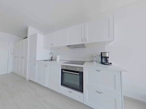 Fridge, microwave, stovetop, cookware/dishes/utensils