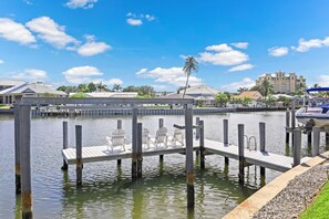 Relax on the dock with comfortable seating, taking in the serene views of the marina.