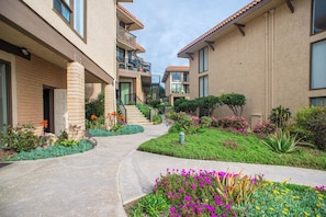 Stunning courtyard with lush greenery and balconies.