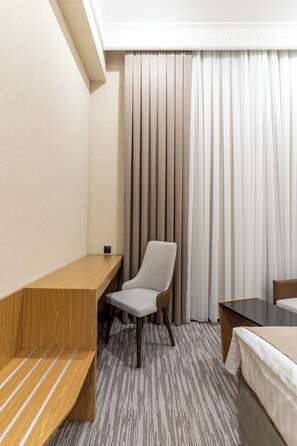 Ropa de cama de alta calidad y minibar 