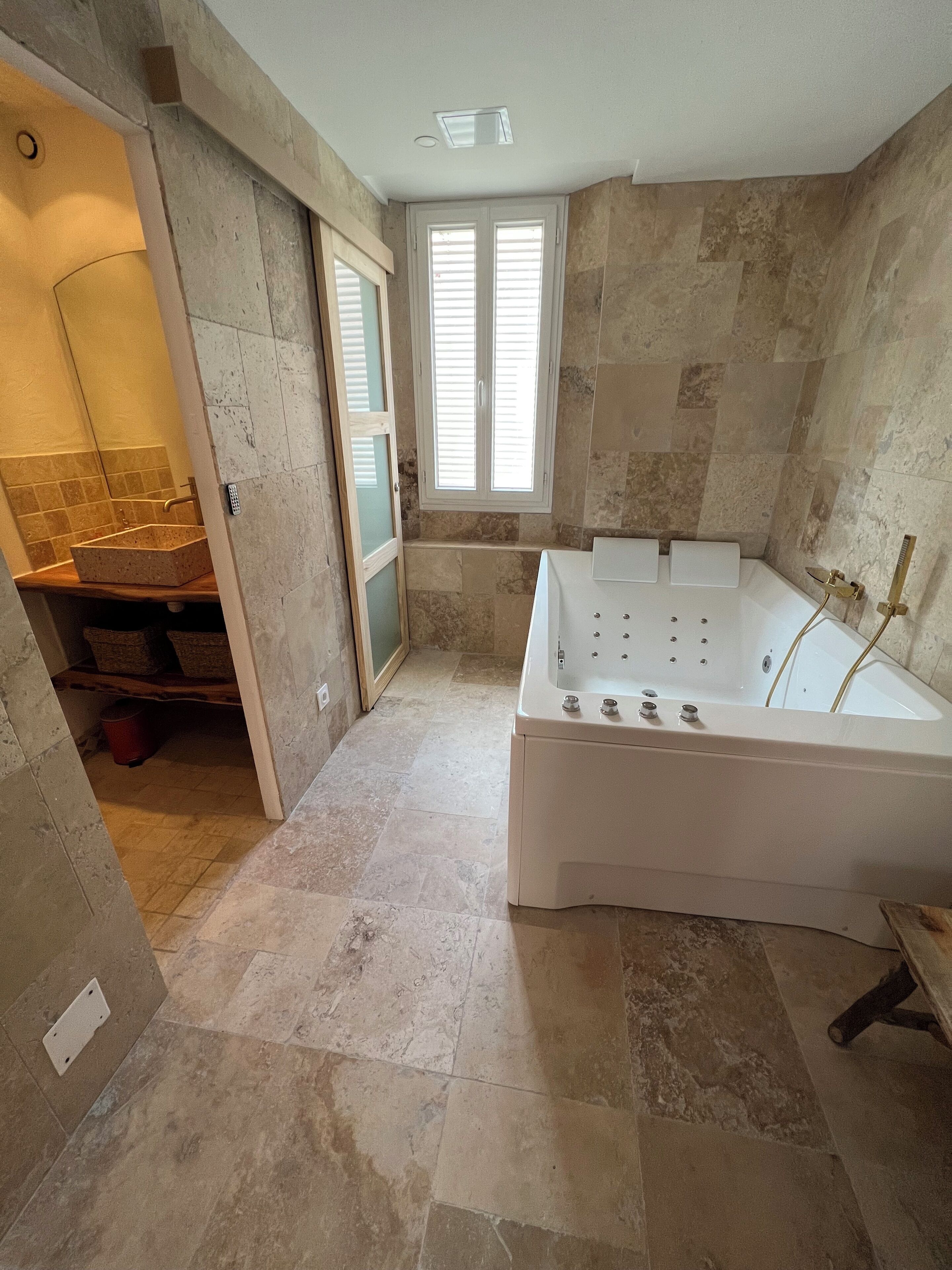 Jetted tub, hair dryer, towels, soap