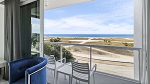 A balcony with a view of the beach and ocean. - NEW Beachfront Condo Resort on The Beach (Treasure Island)