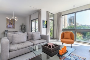 Chic | Living room | 55-inch Smart TV with digital channels, streaming services - Le 115 Aparthotel in Jal El Dib (Jal El Dib)