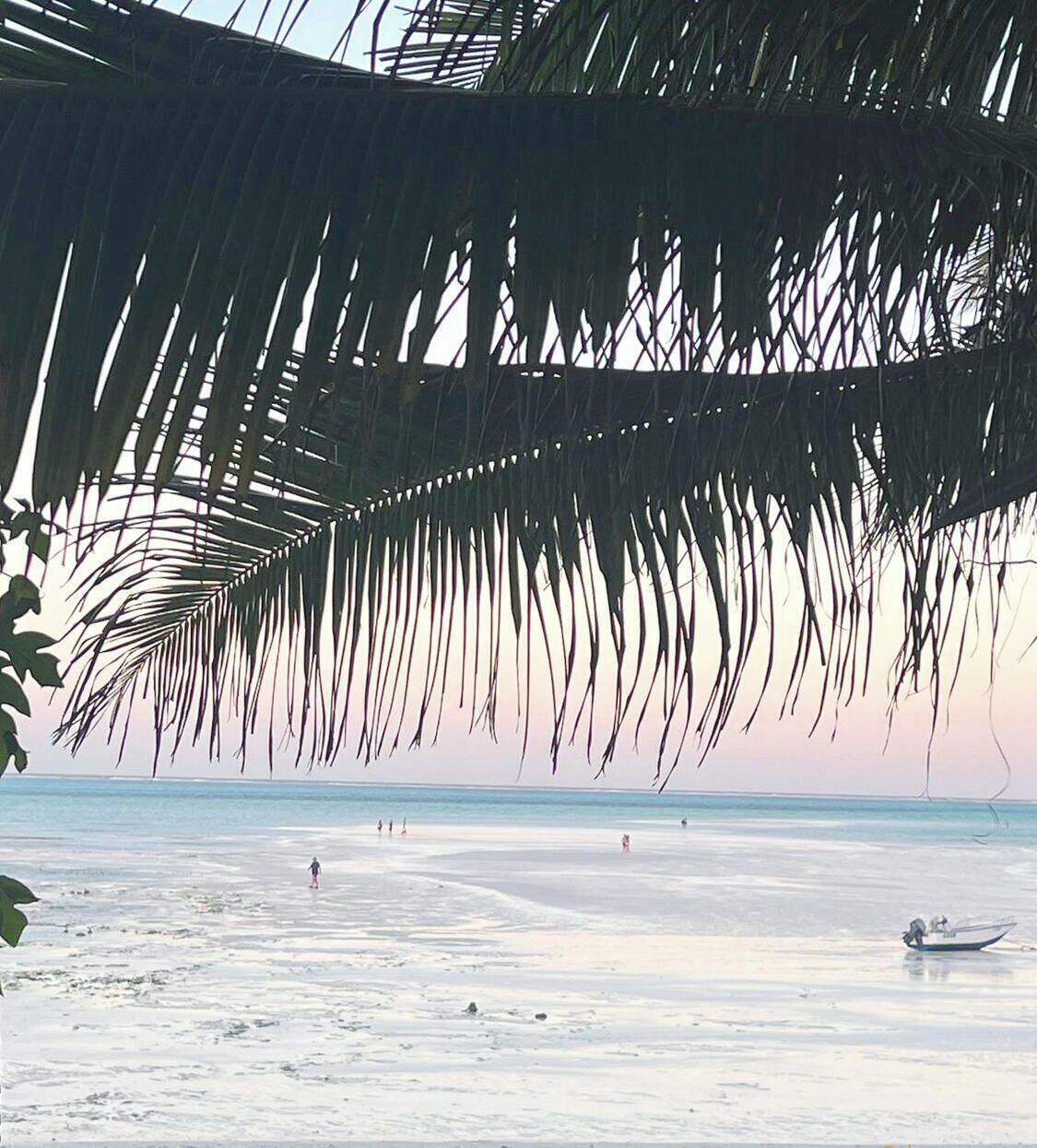 On the beach, white sand, sun-loungers, beach umbrellas