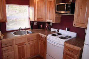 Cabin, 1 Bedroom | Private kitchen | Fridge, oven, coffee/tea maker, toaster