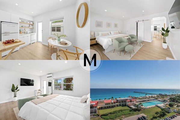 A modern hotel interior with a kitchen, dining area, bedroom, and a view of the ocean.