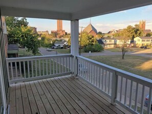 Enjoy a quiet neighborhood view from this building's porch.