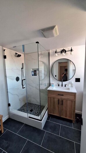 Bathtub, hair dryer, towels, soap
