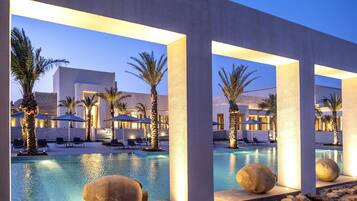 Indoor pool, seasonal outdoor pool, pool umbrellas, pool loungers