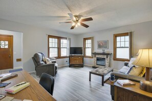 TV, fireplace, books