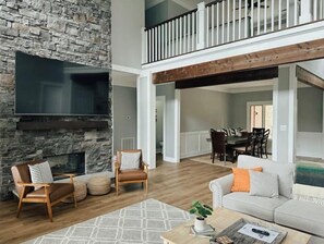 Smart TV, fireplace, books, printers