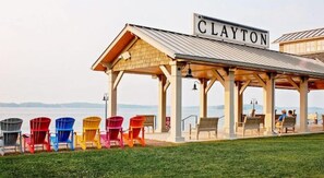 Relax in the Clayton pavilion, surrounded by a serene lawn and scenic views.
