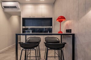 Fridge, microwave, stovetop, coffee/tea maker