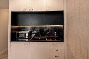 Fridge, microwave, stovetop, coffee/tea maker