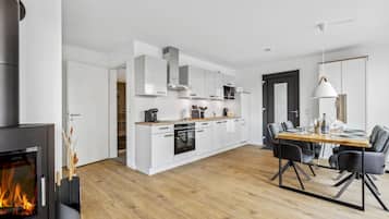 Fridge, stovetop, dishwasher, coffee/tea maker