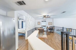 Enjoy communal dining or meetings in this well-appointed space with a round table and chairs.