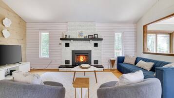 Smart TV, fireplace, foosball, books