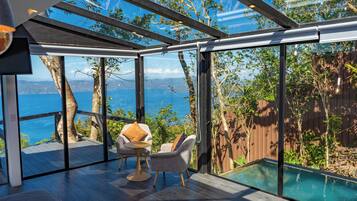 Suite Signature | Area soggiorno | Smart TV, Netflix, pavimenti riscaldati, servizi in streaming