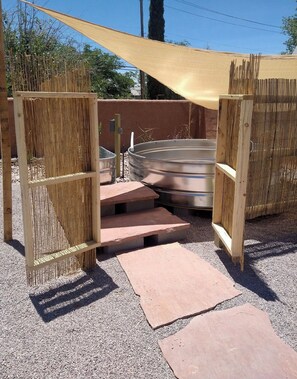 A metal swimming pool with a wooden fence and steps leading to it. - Casita De Agua Encanto, 
Natural Hot Mineral Spring Property  (Truth or Consequences)