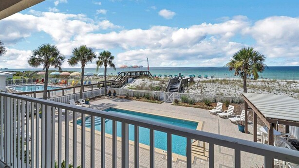 A pool area with a view of the beach and ocean. - Direct Gulf Views, Private Pool, Sleeps 4 (Fort Walton Beach)