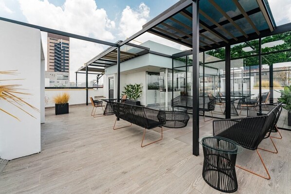 Relax in this open-plan living space with a high ceiling and expansive views.