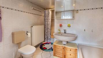 Bathtub, hair dryer, towels