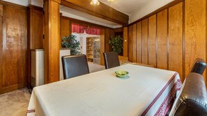 A dining area with a table, chairs, and a chandelier. - Apartment 'Ferienwohnung Im Harz' with Wi-Fi (Harzgerode)