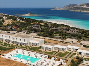 A resort with a swimming pool, beach, and ocean views. - Stunning Capo Falcone Charming Superior Apartments 1 bedroom sleeps 4 persons (Stintino)