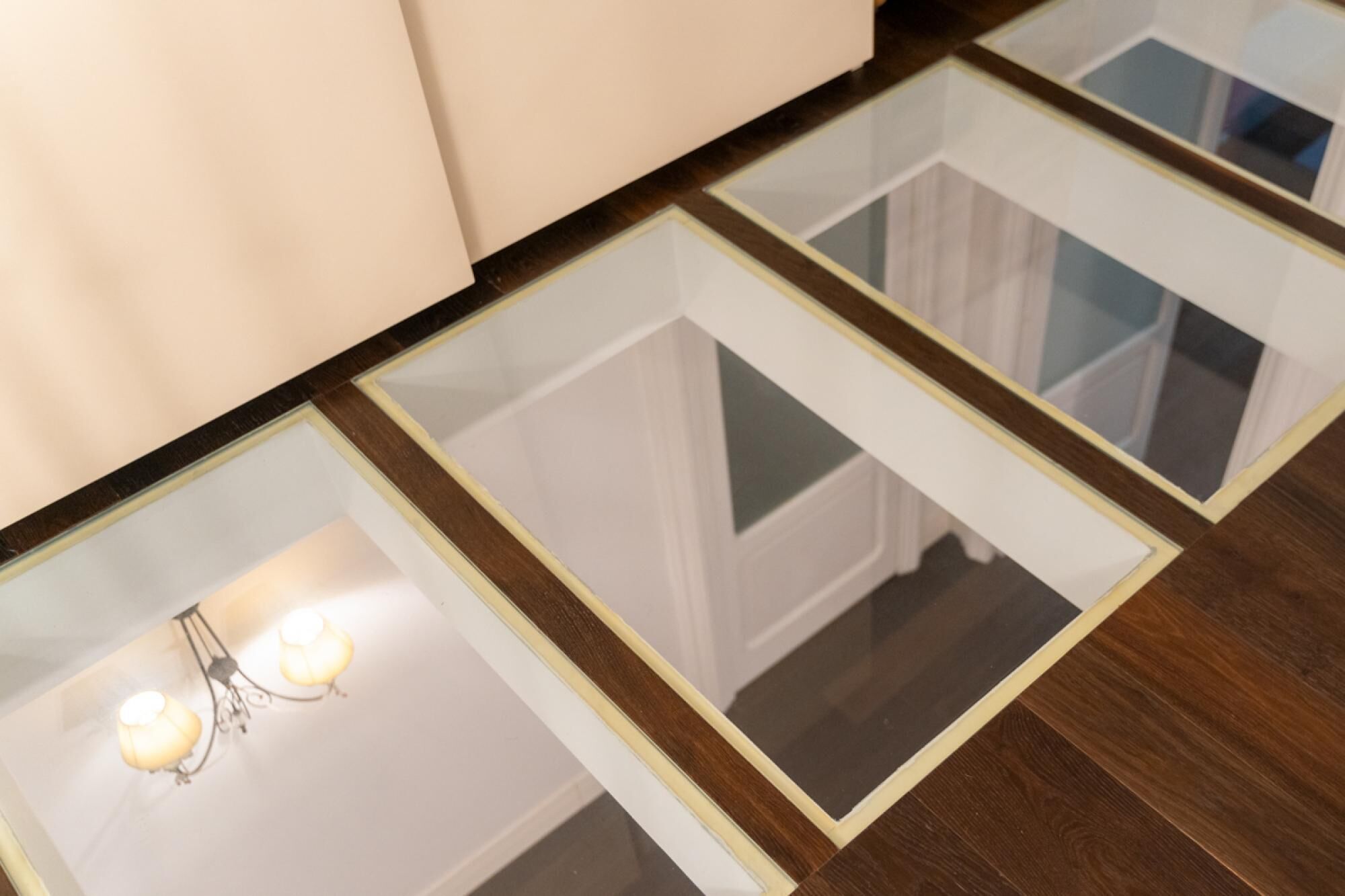 A floor with glass panels and a light fixture.
