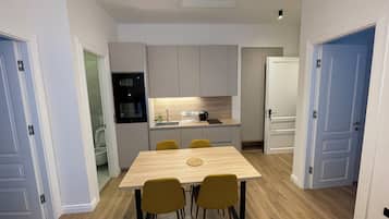 Premium Apartment, 2 Bedrooms | Private kitchen | Fridge, microwave, electric kettle, cookware/dishes/utensils