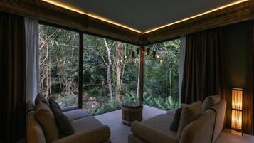 Rainforest Villa | Living area | 24-inch flat-screen TV with cable channels