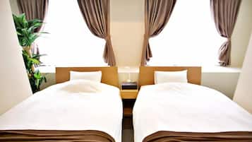 A mirrored room with two beds, brown curtains, a nightstand, and a potted plant.