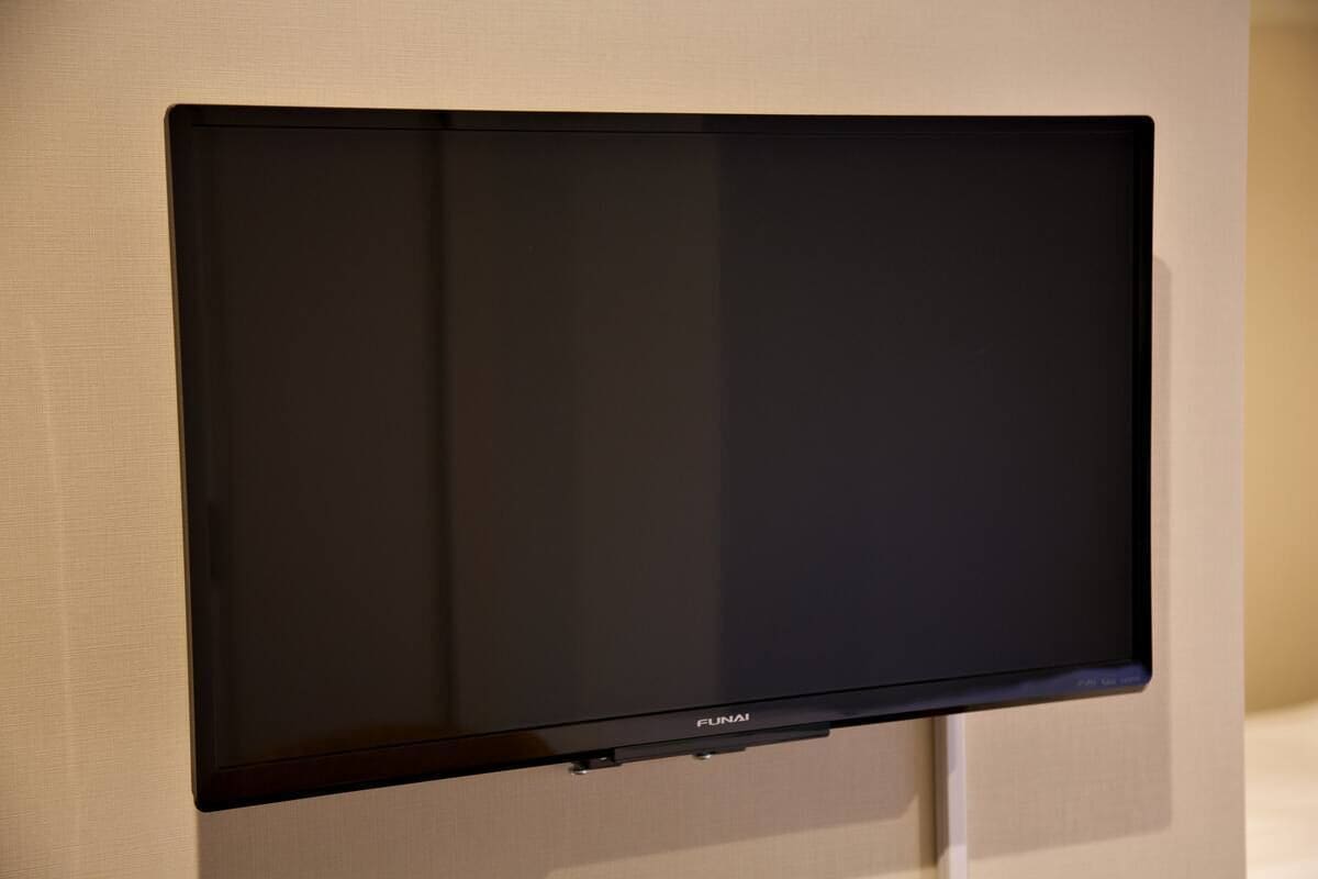A flat-screen TV mounted on a wall.