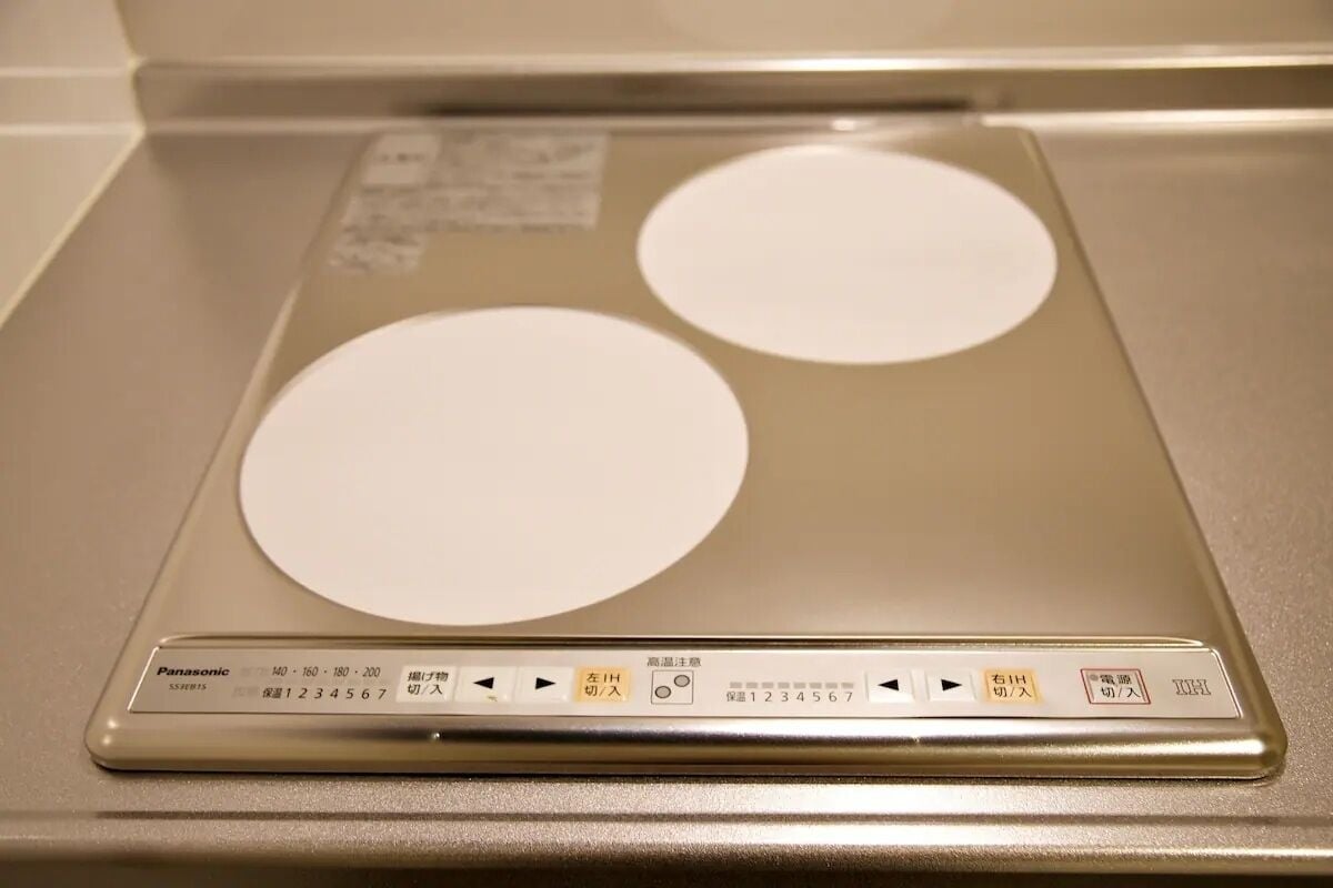 A bathroom scale with Japanese instructions and a digital display.