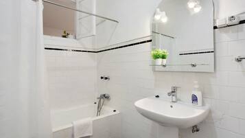 Bathtub, hair dryer, towels