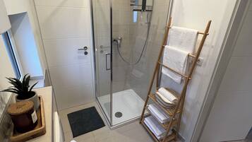 Shower, hair dryer, towels, soap