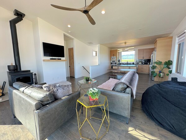 A modern living room with a fireplace, sofa, and coffee table.